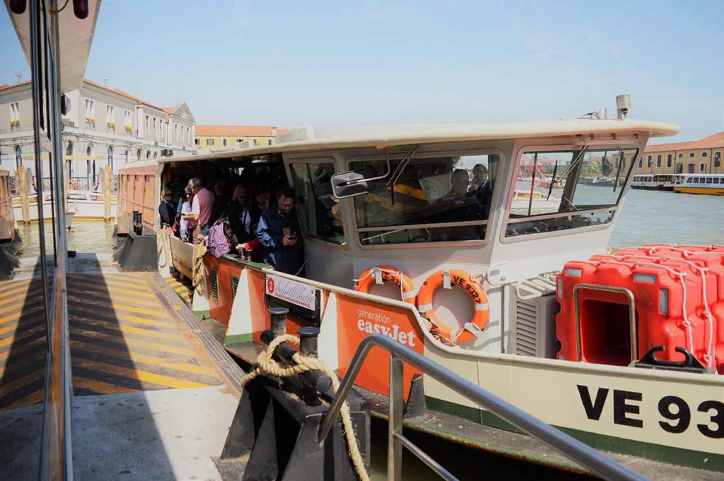 A route No 2 Vaporetto or water bus packed with passengers at the