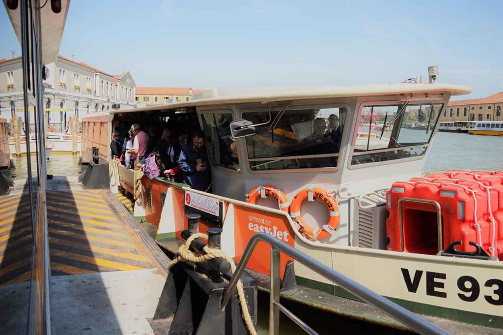 Passengers on board a Route no 2 Vaporetto or water bus on The